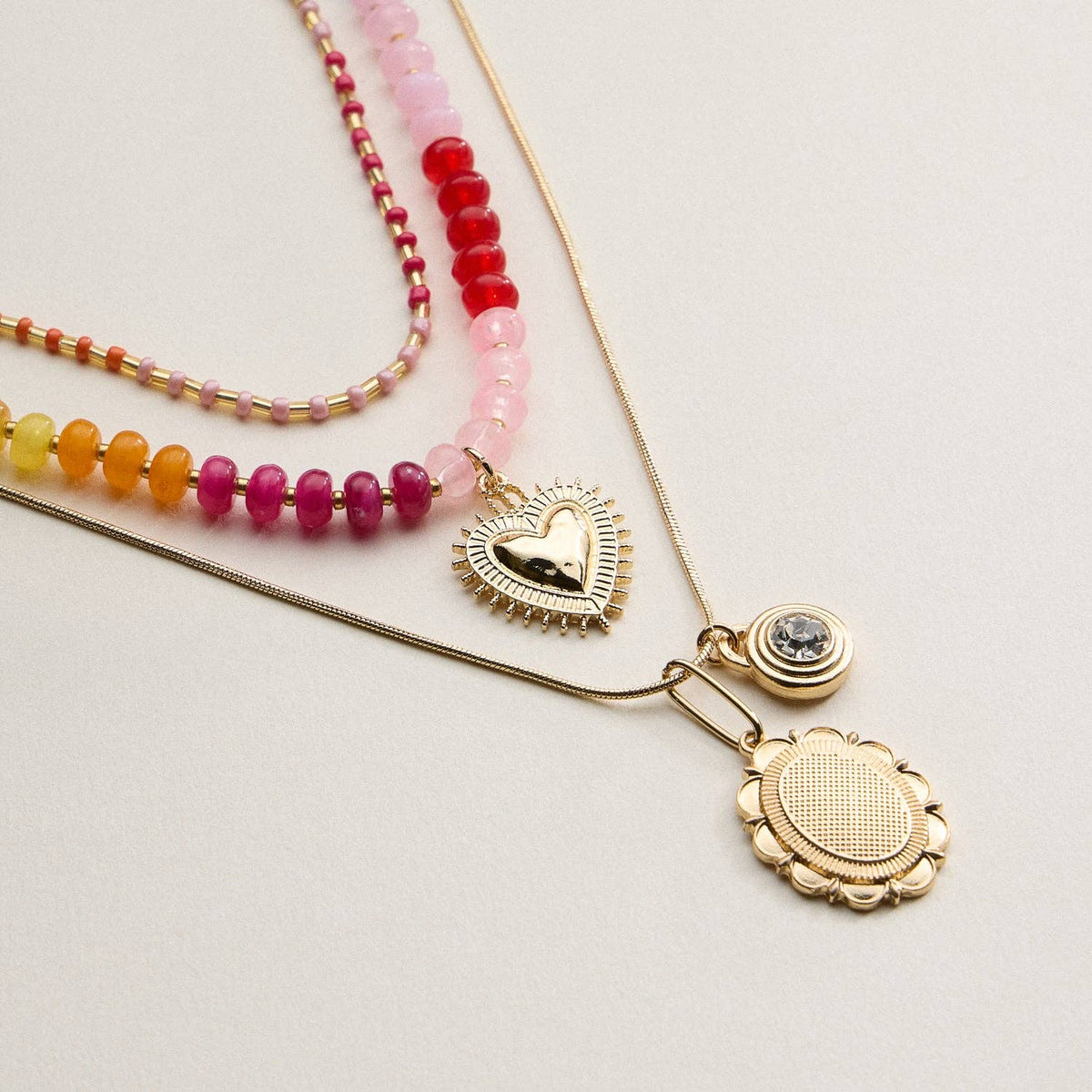 Layered Beaded and Pendant Necklace Set with Gold Accents – Heart and Charm Detail