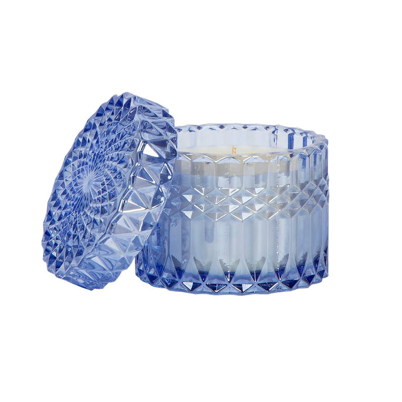 Santorini Breeze 8oz Petite Shimmer Candle in a stunning aqua diamond-cut glass jar, glowing with a soft shimmer. Infused with Mediterranean sea spray, oud wood, and white blossom, this luxury soy wax candle creates a serene coastal ambiance. Perfect for home décor, relaxation, and gifting.