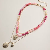 Layered Beaded and Pendant Necklace Set with Gold Accents – Heart and Charm Detail