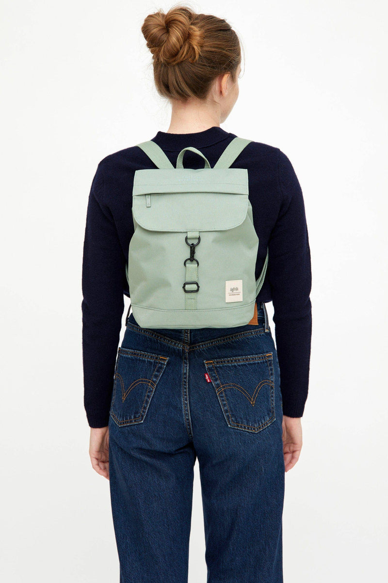 Scout Mini Backpack – lightweight, water-resistant, and eco-friendly bag made from OXFORD RPET fabric. Features adjustable cotton straps, a spacious main compartment, a quick-access flap pocket, and a hidden security pocket. Perfect for everyday use, school, or travel.