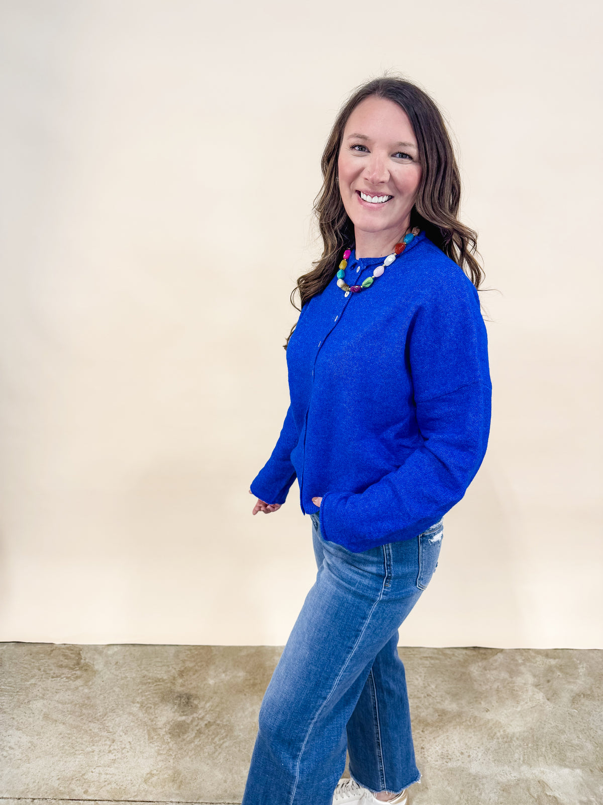 Royal blue button front cardigan with rolled hem and sleeves. 