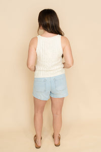 Womens knit tank top in cream paired with denim shorts for a casual summer outfit