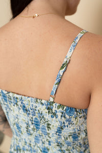 Back view of blue floral maxi dress adjustable straps. 