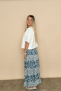 Side view of blue floral maxi skirt. 