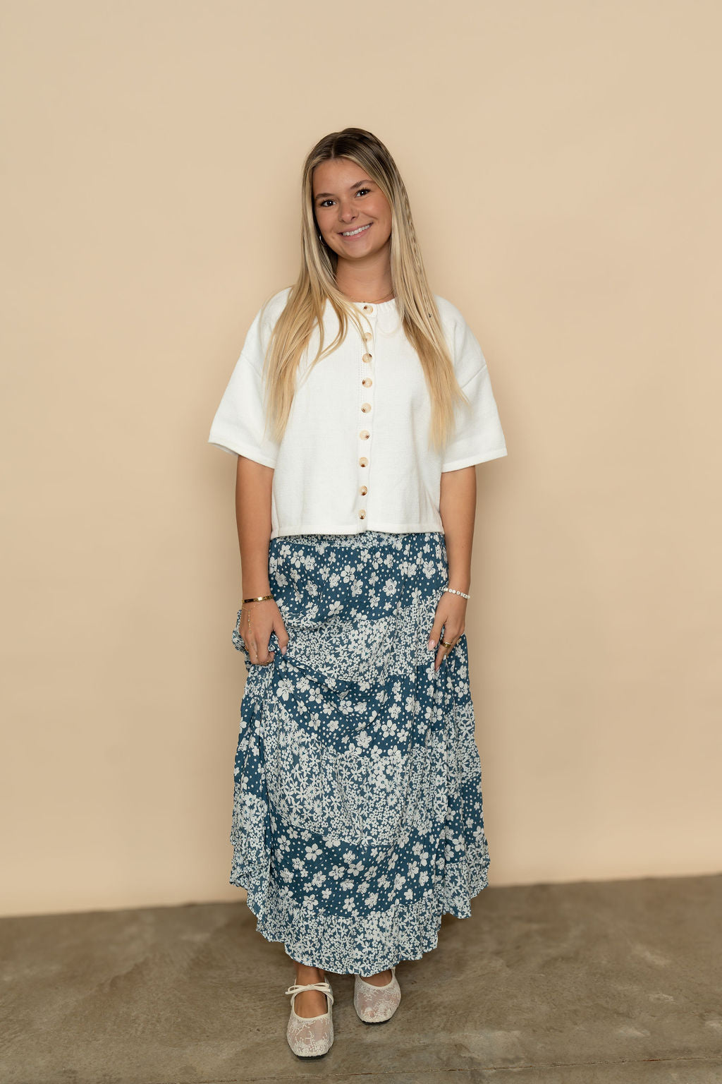Blue floral maxi skirt styled with a short sleeve cardigan for an easy spring outfit. 