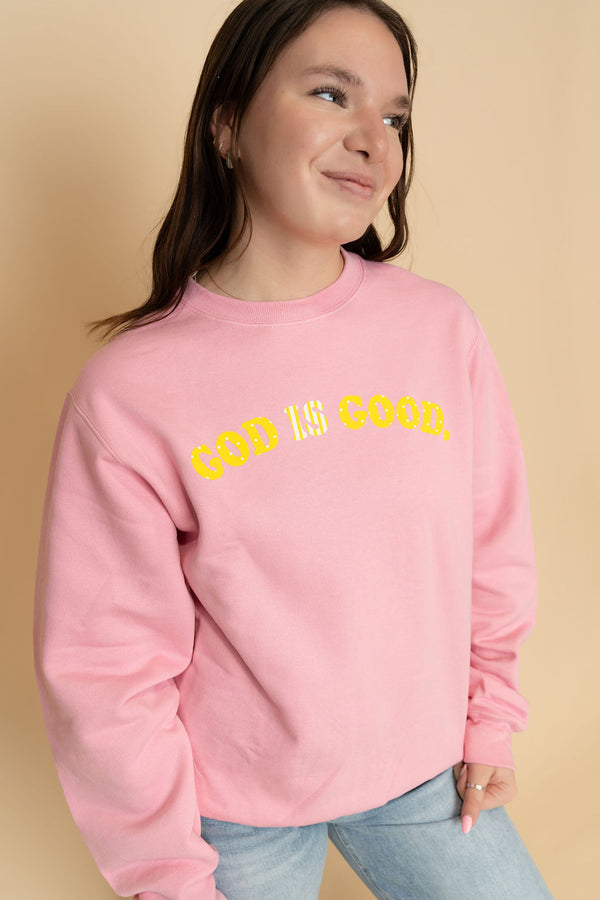 Pink sweatshirt with god is good all the time printed in yellow for a fun graphic tee. 