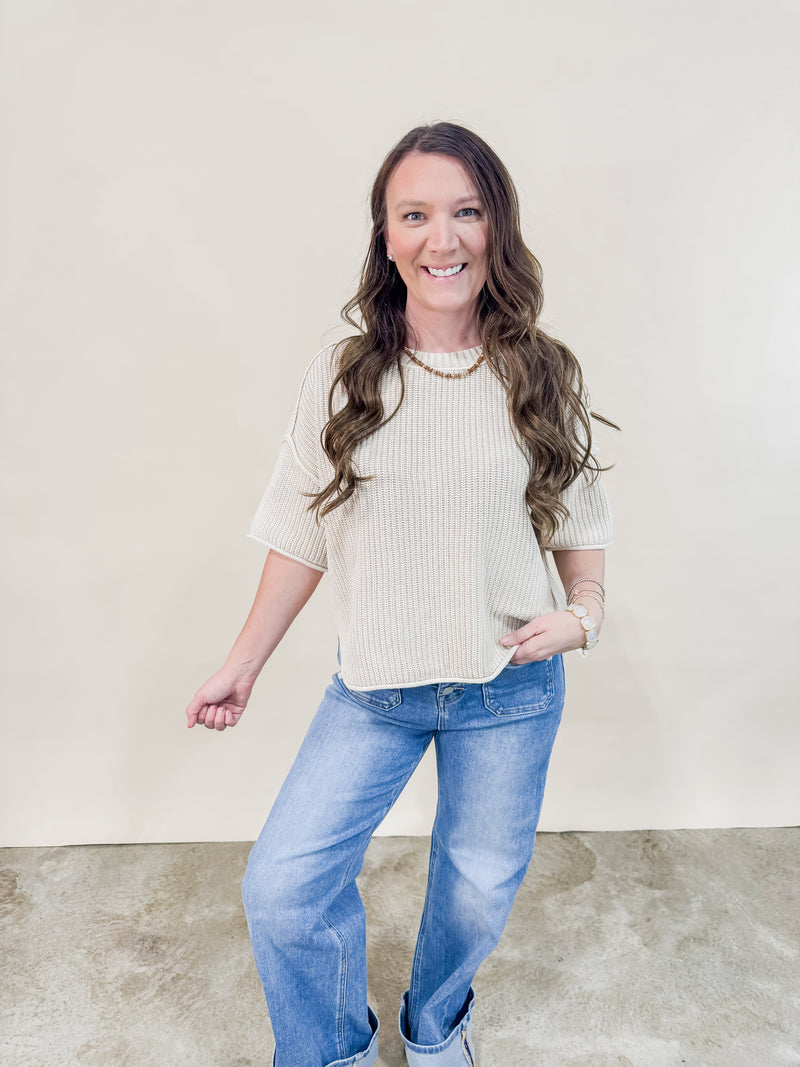 Ivory knit short sleeve sweater paired with Risen Cuffed denim jeans for a casual spring outfit. 