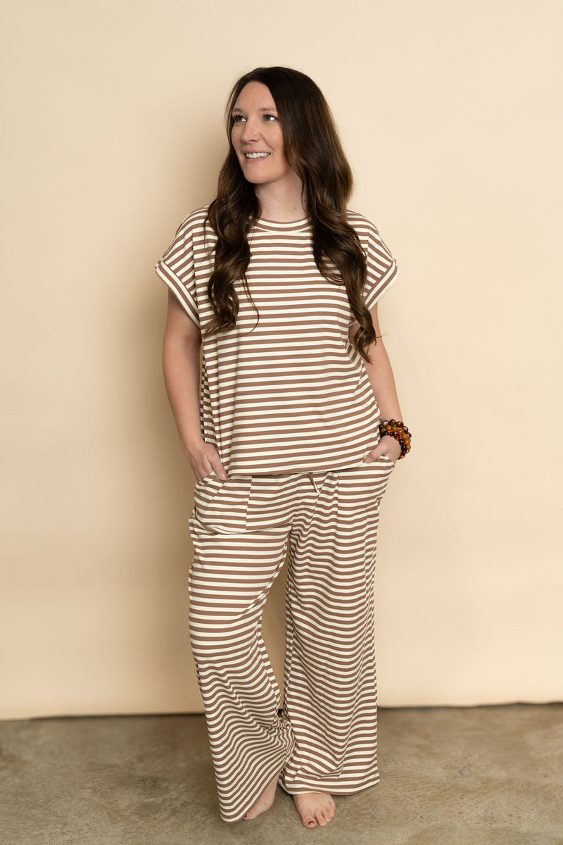 Brown and cream striped lounge set featuring short sleeve top and long pant bottoms for a cozy casual outfit. 