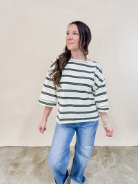 Ivory and black oversized striped tee paired with cuffed straight leg Risen jeans for an easy comfortable outfit. 