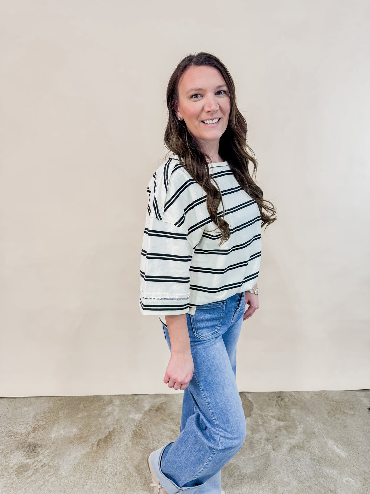 Ivory and Black striped oversized tee paired with cuffed denim jeans for an easy effortless women's outfit. 