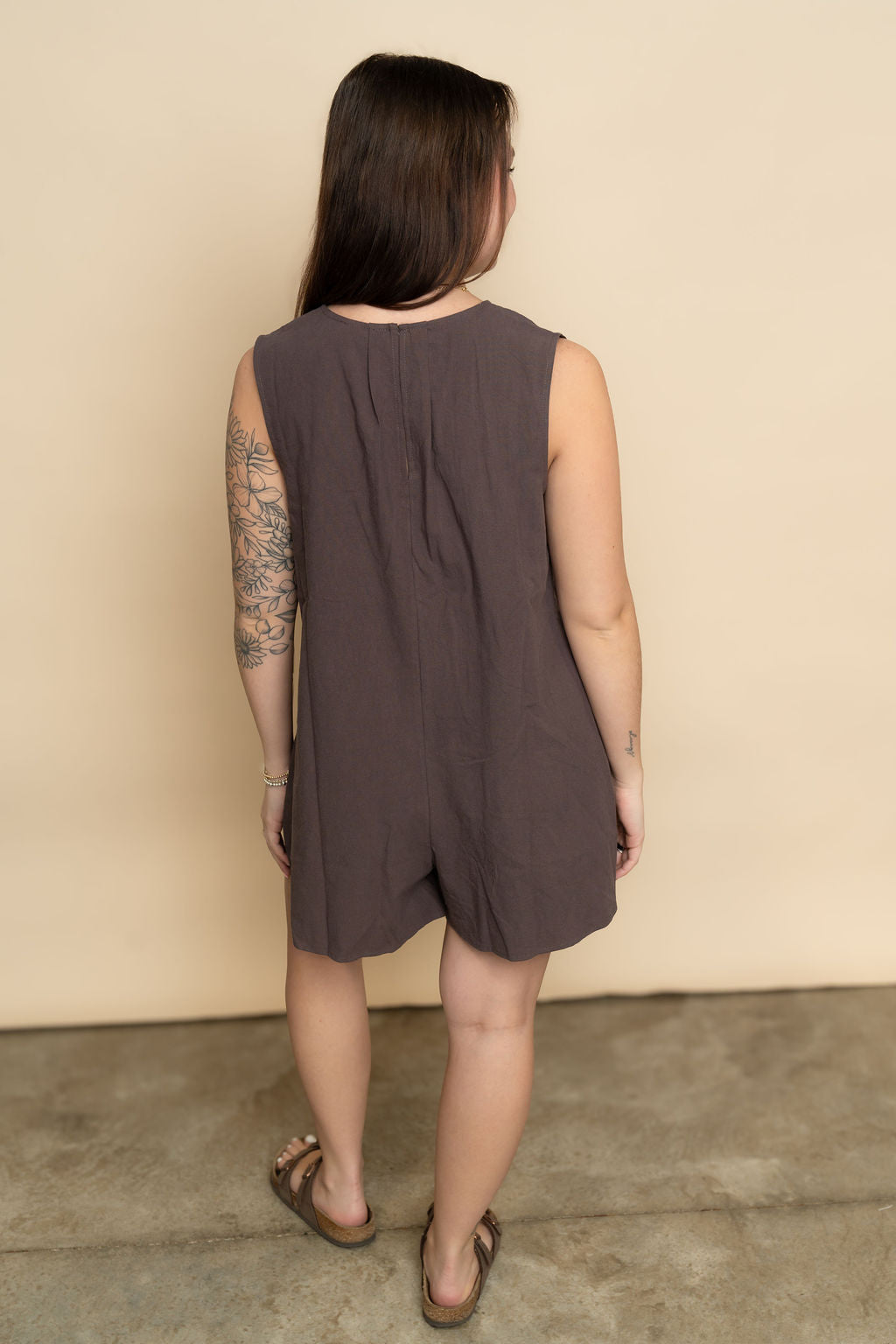 Back view of mocha brown shorts romper for women. 