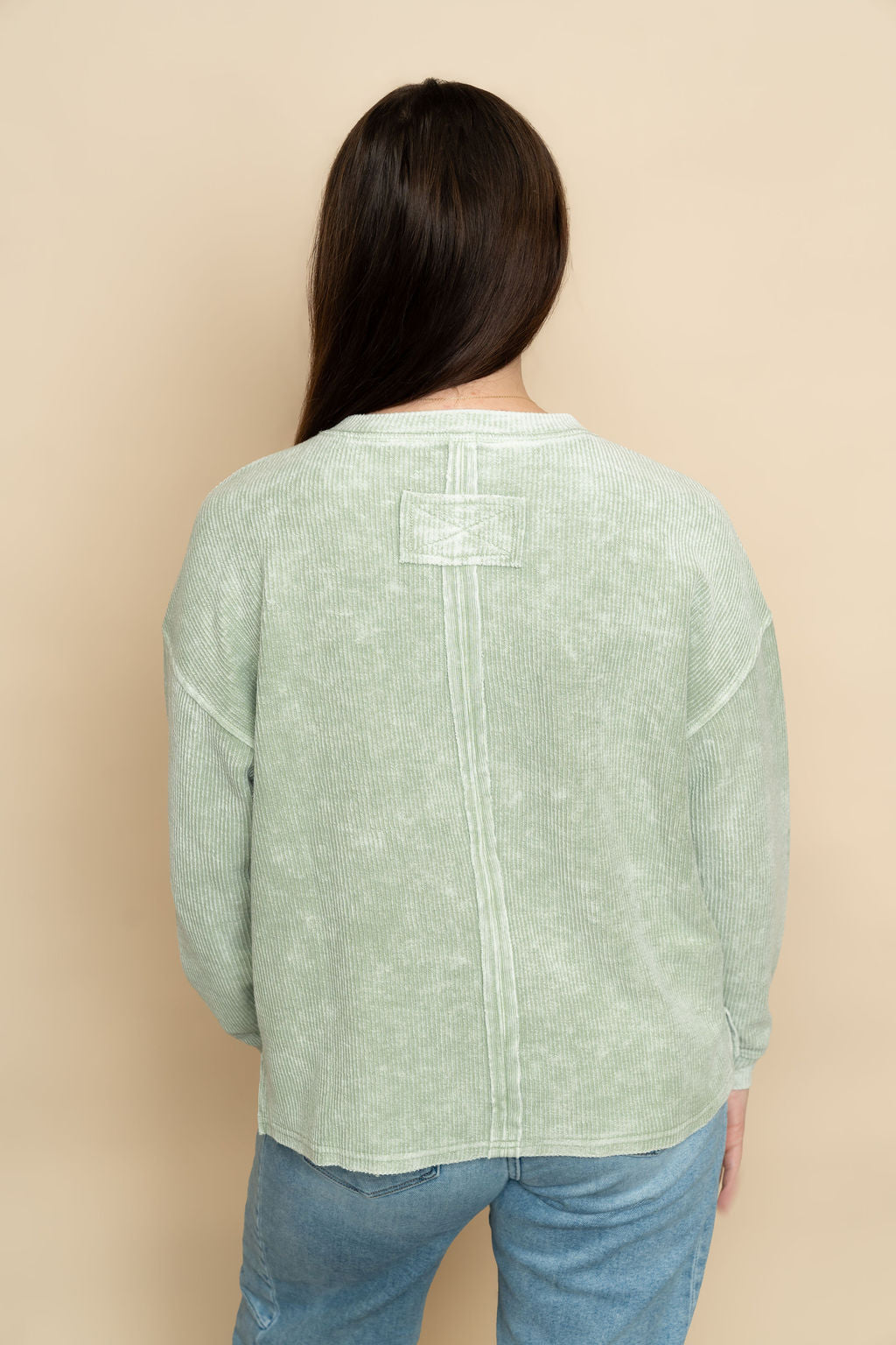 Back of sage long sleeve basic top for women. 