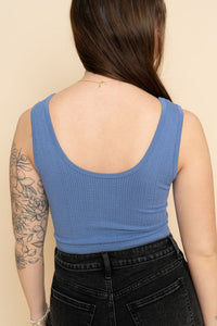 Back view of women's blue seamless cami tank top. 