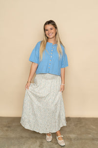 Blue short sleeve cardigan sweater paired with floral maxi skirt for a cute spring outfit for women. 