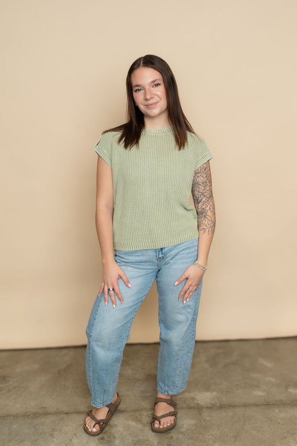 Sage short sleeve knit sweater paired with light wash barrel jeans for a cute casual outfit for women. 