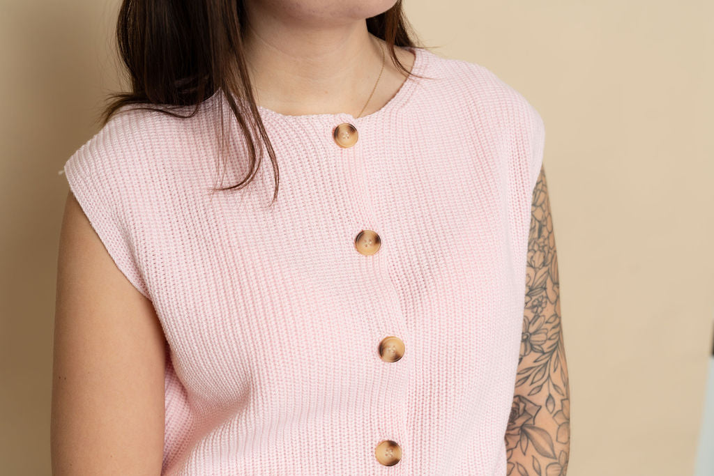 Pink ribbed knit sleeveless sweater vest for a casual spring outfit. 