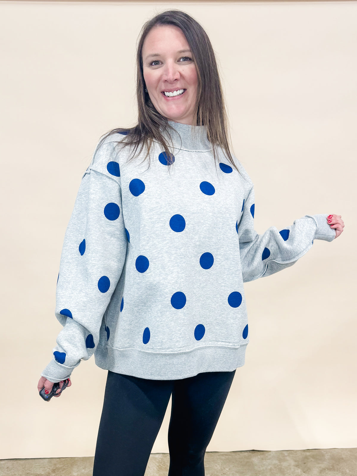 Heather Gray and polka dot reversible mock neck sweatshirt. 