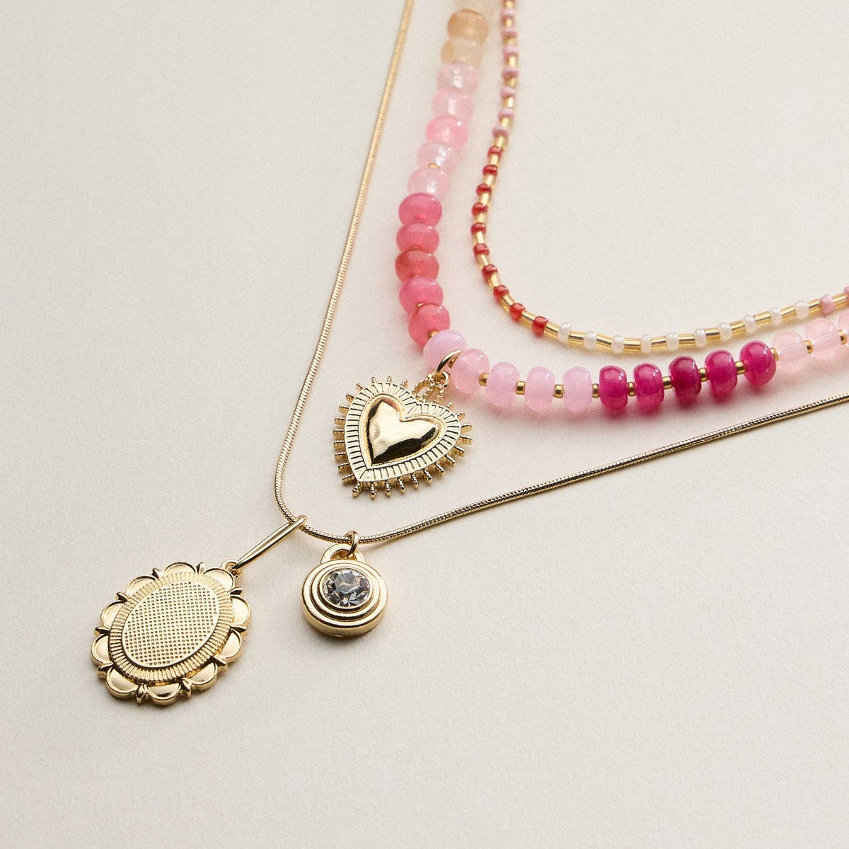 Layered Beaded and Pendant Necklace Set with Gold Accents – Heart and Charm Detail